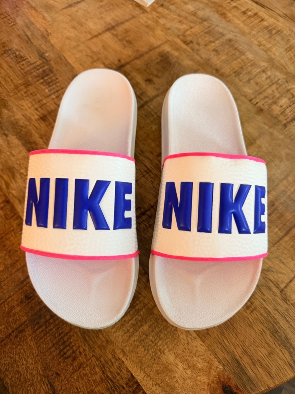 Nike White Slide Sandals with Blue Logo and Pink Trim for Women